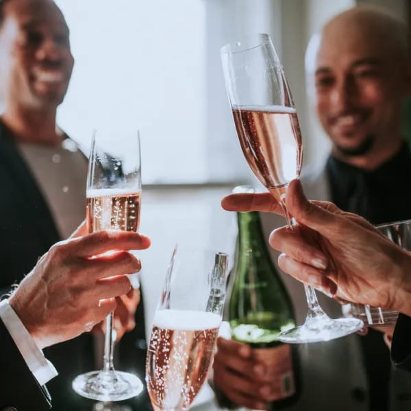 Guests toasting with glasses of sparkling wine