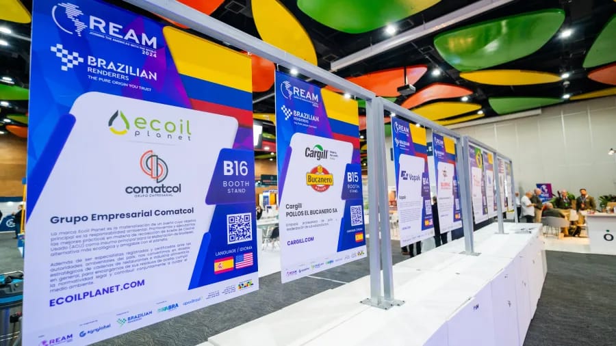 REAM booth posters for exhibiting companies lined up along the business-stand area